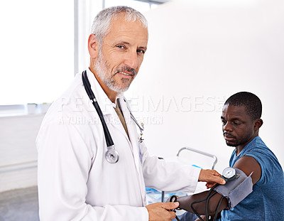 Buy stock photo Doctor, man and patient for blood pressure at hospital with  sphygmomanometer, hypertension and heart health. People, machine exam and medical assessment of diabetes, check cholesterol and healthcare