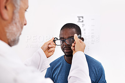 Buy stock photo Cropped shot of an optometrist testing a patient's eyesight