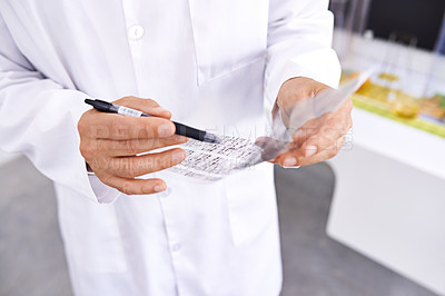 Buy stock photo Person, biologist and writing with hands for dna test, exam or chemical experiment at laboratory. Closeup, scientist or researcher taking notes for trial and error on chemistry, biology or science