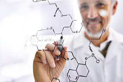 Buy stock photo Shot of a mature male scientist working with chemistry formulas in his lab