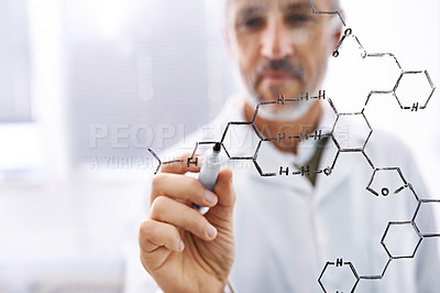 Buy stock photo Shot of a mature male scientist working with chemistry formulas in his lab