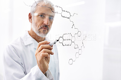 Buy stock photo Shot of a mature male scientist drawing molecule structures on a glass surface