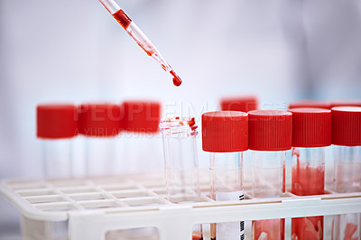 Buy stock photo Cropped shot of a scientist working with blood samples in the lab