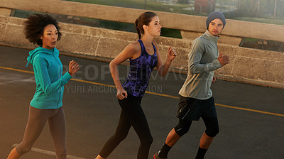 Buy stock photo Workout, city and people running at sunset together for sports training, commitment and body health. Evening, exercise and group of friends on road for urban fitness with outdoor challenge on street