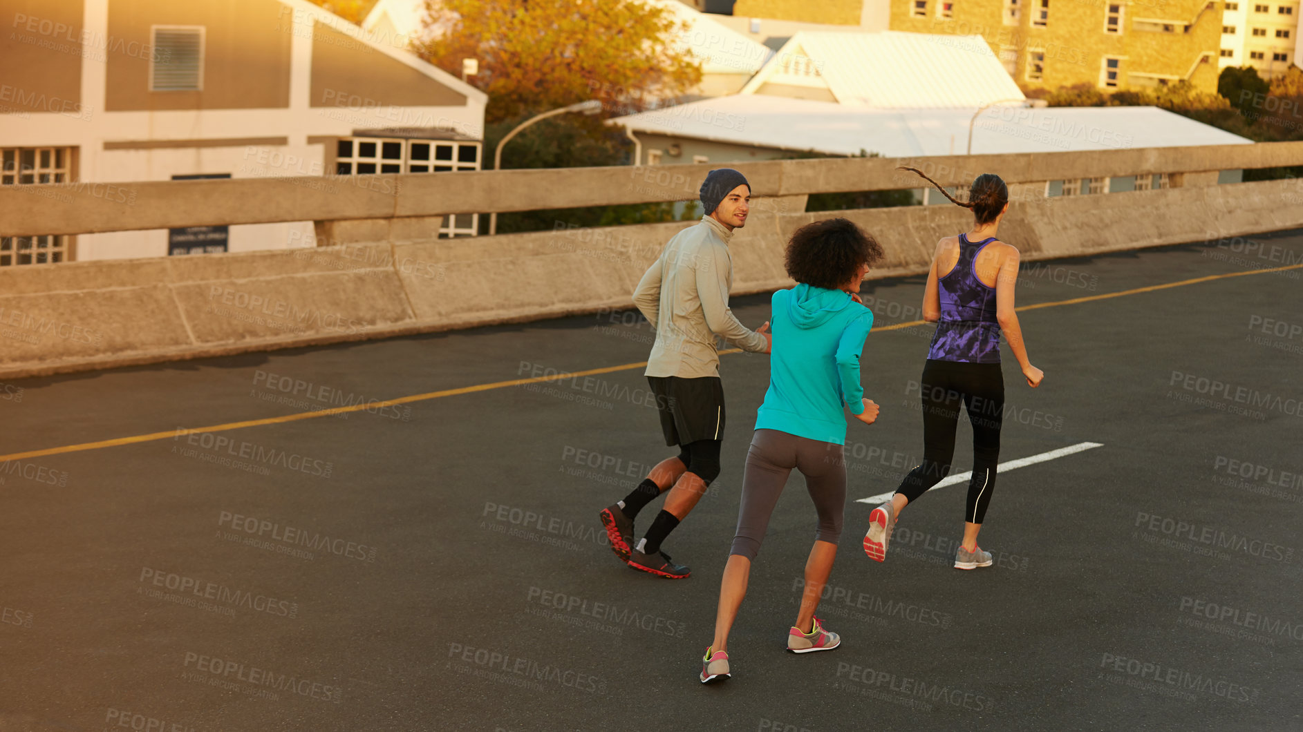 Buy stock photo Urban, workout and people running on street together for sports training, commitment and body health. Evening, exercise and group of friends on road for city fitness with outdoor wellness challenge