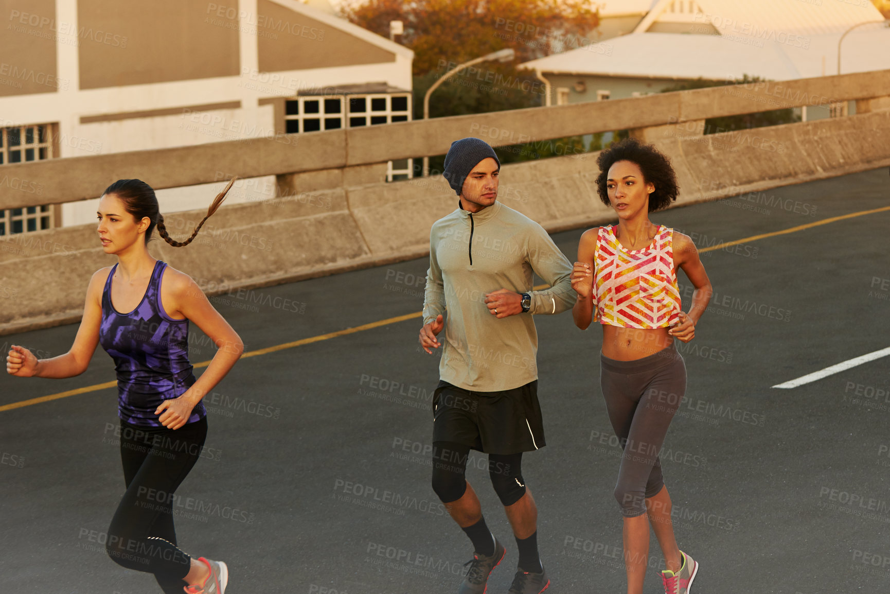 Buy stock photo Fitness, people and running with group on street in city for workout, training or outdoor exercise together. Active, young runners or team in race for cardio or practice on road in health or wellness