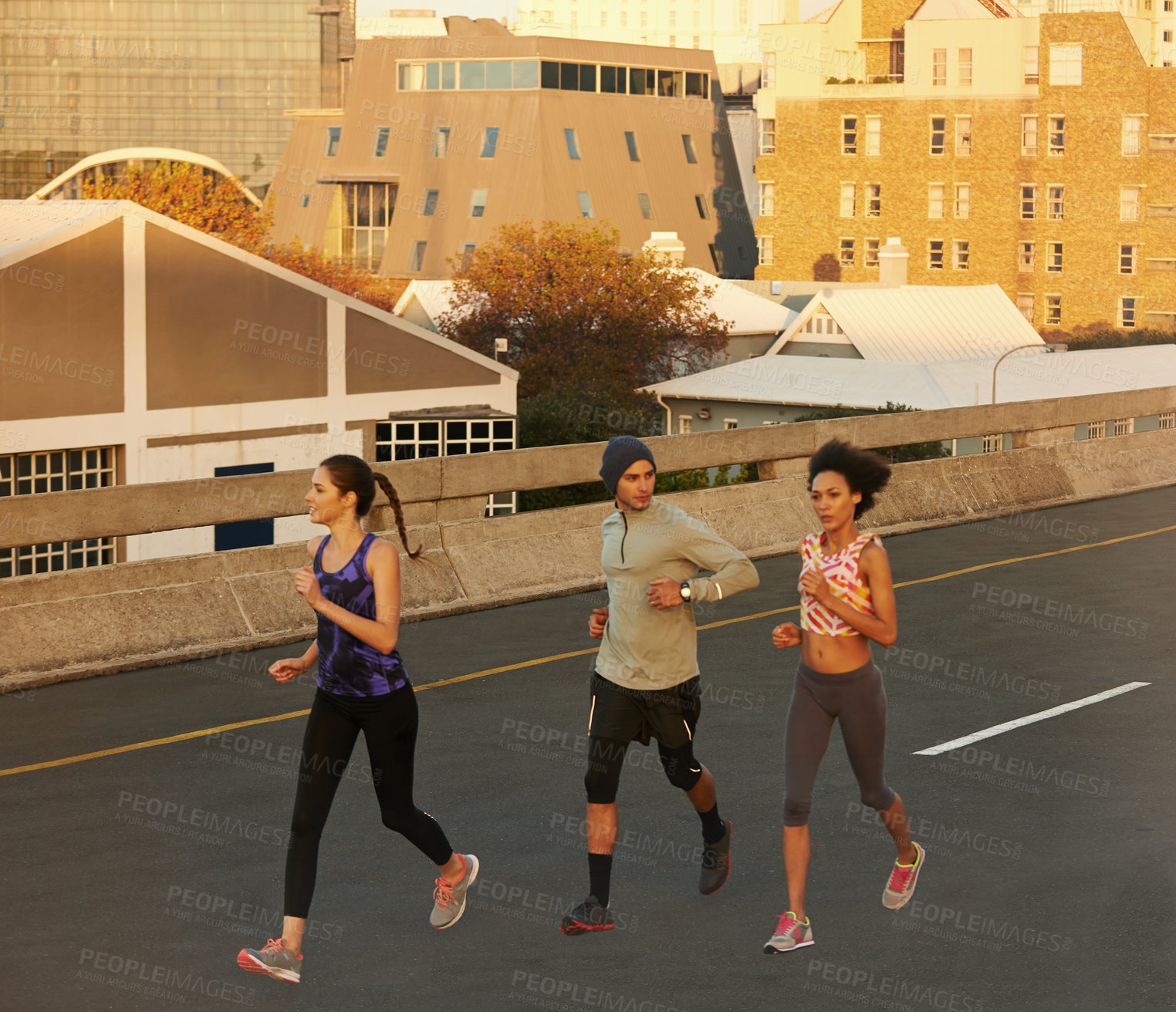 Buy stock photo Urban, training and people on street running together for sports workout, commitment and body health. Evening, city and group of friends on road for fitness, exercise or outdoor wellness challenge