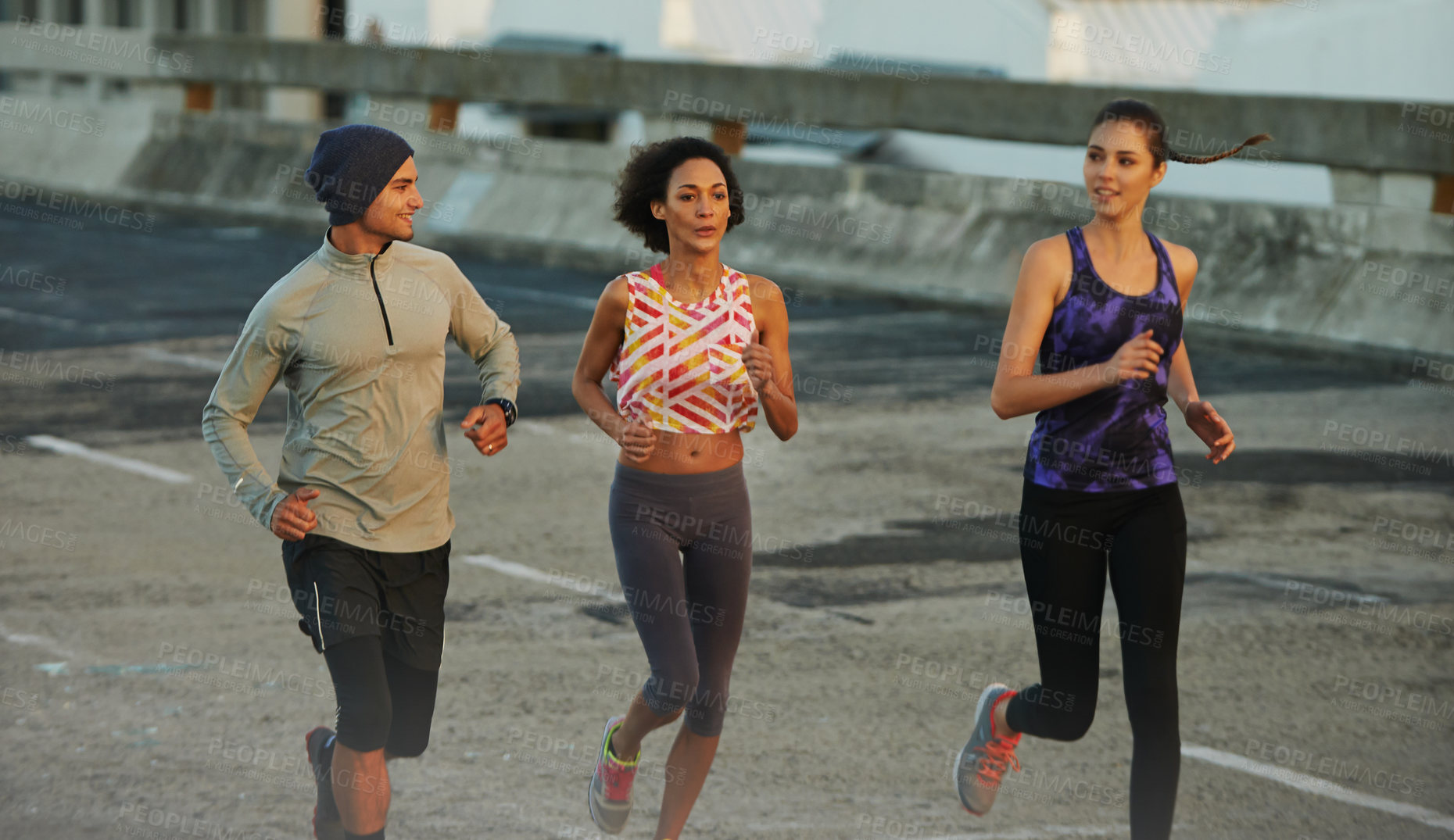 Buy stock photo City, concrete and people running together for fitness, training or commitment to healthy body. Road, exercise and group of friends on street for urban workout with outdoor challenge on bridge