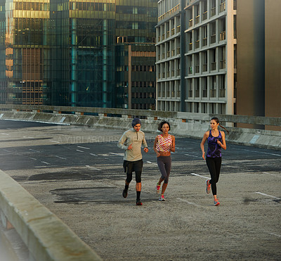 Buy stock photo City, buildings and people running together for fitness, training or healthy body commitment. Morning, exercise and group of friends on street for urban workout, sports and outdoor challenge on road