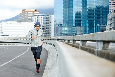 Buy stock photo Fitness, running and portrait of man in city for training, exercise or cardio for healthy body. Sports, race and runner on street bridge for wellness, energy and workout to lose weight in Argentina
