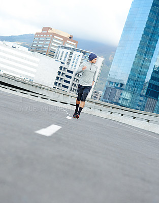 Buy stock photo Fitness, running and man on street for cardio jog, exercise and training for healthy body. Sports, race and runner in city outdoor for wellness, energy and workout on bridge in winter for marathon