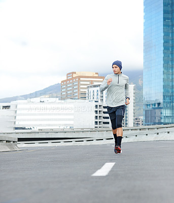 Buy stock photo Fitness, running and man in city for cardio jog, race or training for healthy body. Sports, exercise and runner on street outdoor for wellness, energy or workout on bridge in winter with mockup space