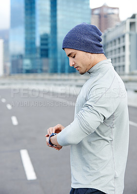 Buy stock photo Man, check and watch on road for fitness, heart rate and wellness app for tracking after exercise challenge. City, male person or runner with smart clock for running time, training progress and pulse