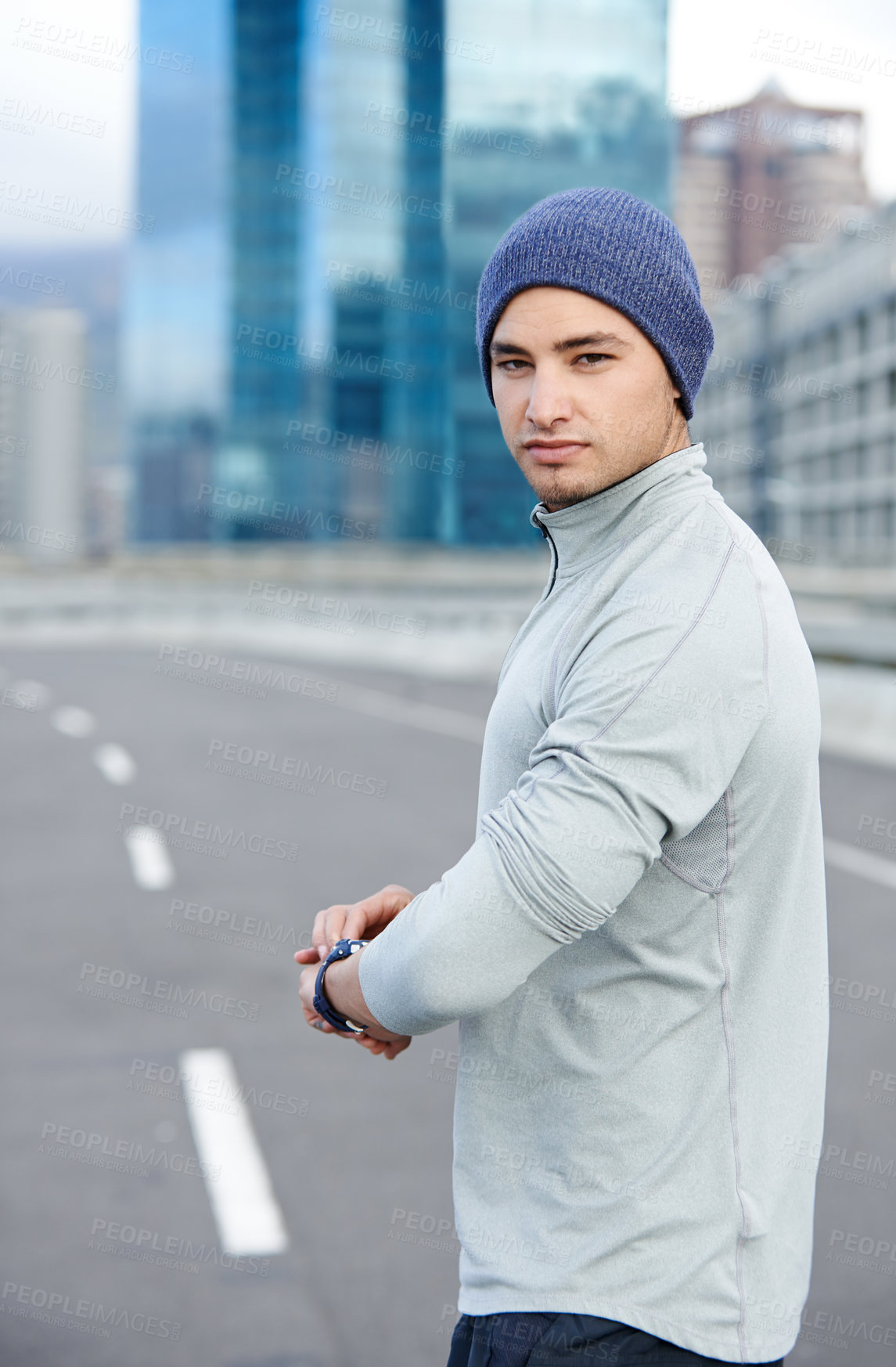 Buy stock photo Running, smart watch and portrait of man in city for training, heart rate and wellness app. Health, exercise and marathon workout with runner on road for speed, cardio and sports performance tracker