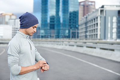 Buy stock photo Running, smart watch and check with man in city for training, heart rate and wellness app. Health, exercise and marathon workout with runner on road for speed, cardio and sports performance tracker