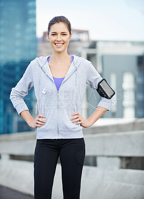 Buy stock photo Portrait, earphones and woman in city for fitness, running or workout on bridge with music. Sports, arm band and female athlete with audio tech for listening to podcast on cardio training in town.