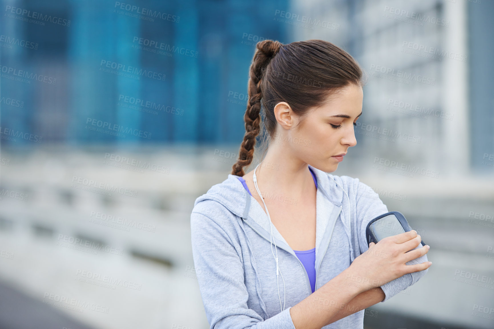 Buy stock photo Running, phone and start with woman in city for training, heart rate and wellness app. Health, exercise and marathon workout with runner on road for speed, cardio and sports performance tracker