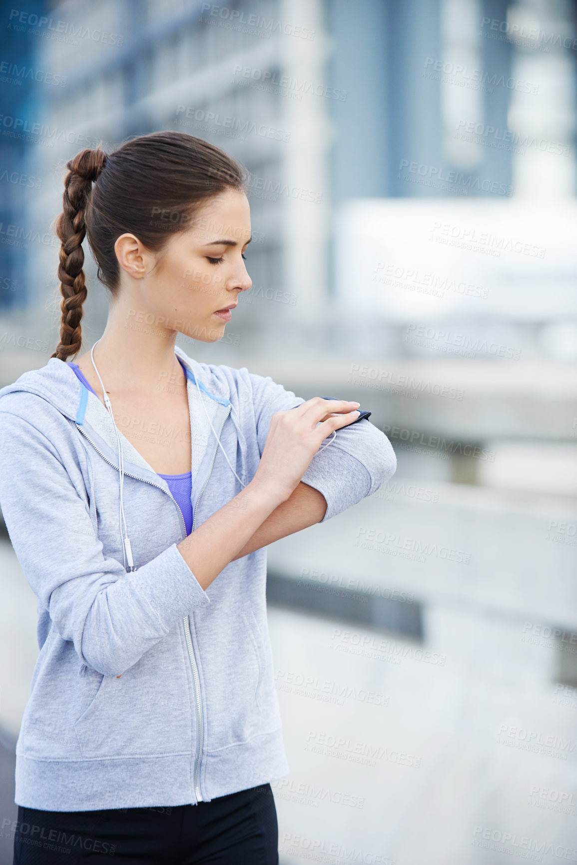 Buy stock photo Running, phone and fitness with woman in city for training, heart rate and wellness app. Health, exercise and marathon workout with runner on road for speed, cardio and sports performance tracker