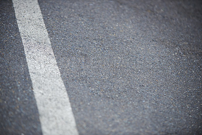 Buy stock photo Closeup shot of a white dividing line on an asphalt road