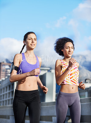 Buy stock photo Bridge, smile and friends with running for fitness, endurance and health benefits with training by blue sky. City, people and women as team for cardiovascular exercise, burn calories and wellness