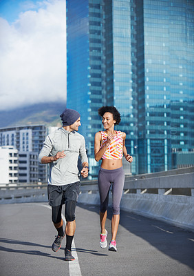 Buy stock photo Bridge, smile and couple with running for fitness, endurance or health benefits with training on road. City, man and woman with support for cardiovascular exercise, burn calories or pace for wellness