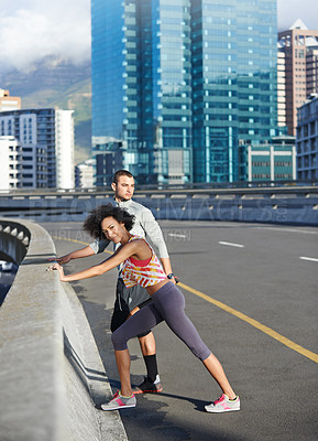 Buy stock photo Fitness, bridge and portrait of couple stretching in city for running with race or marathon training. Sports, road and young man and woman athletes with warm up exercise for cardio workout in town.