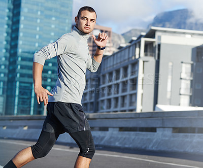 Buy stock photo Running, urban and athlete with man in city for training, fitness and wellness. Health, exercise and marathon workout with male runner in downtown street for speed, cardio and sports performance