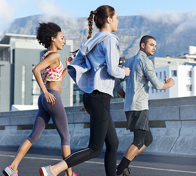 Buy stock photo Running, workout and coaching with friends in city for start of training, fitness and wellness. Race, exercise and marathon cardio with people for personal trainer, health and sports performance