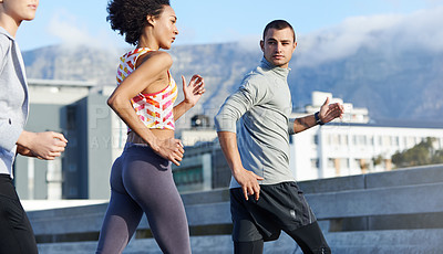 Buy stock photo Running, fitness and coaching with friends in city for start of training, workout and wellness. Race, exercise and marathon cardio with people for personal trainer, health and sports performance