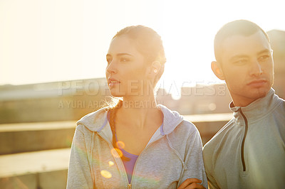 Buy stock photo Runner, woman and man in street at sunrise, arms crossed or thinking for fitness, training and health in morning. People, direction and workout in city for exercise, teamwork and ready for marathon