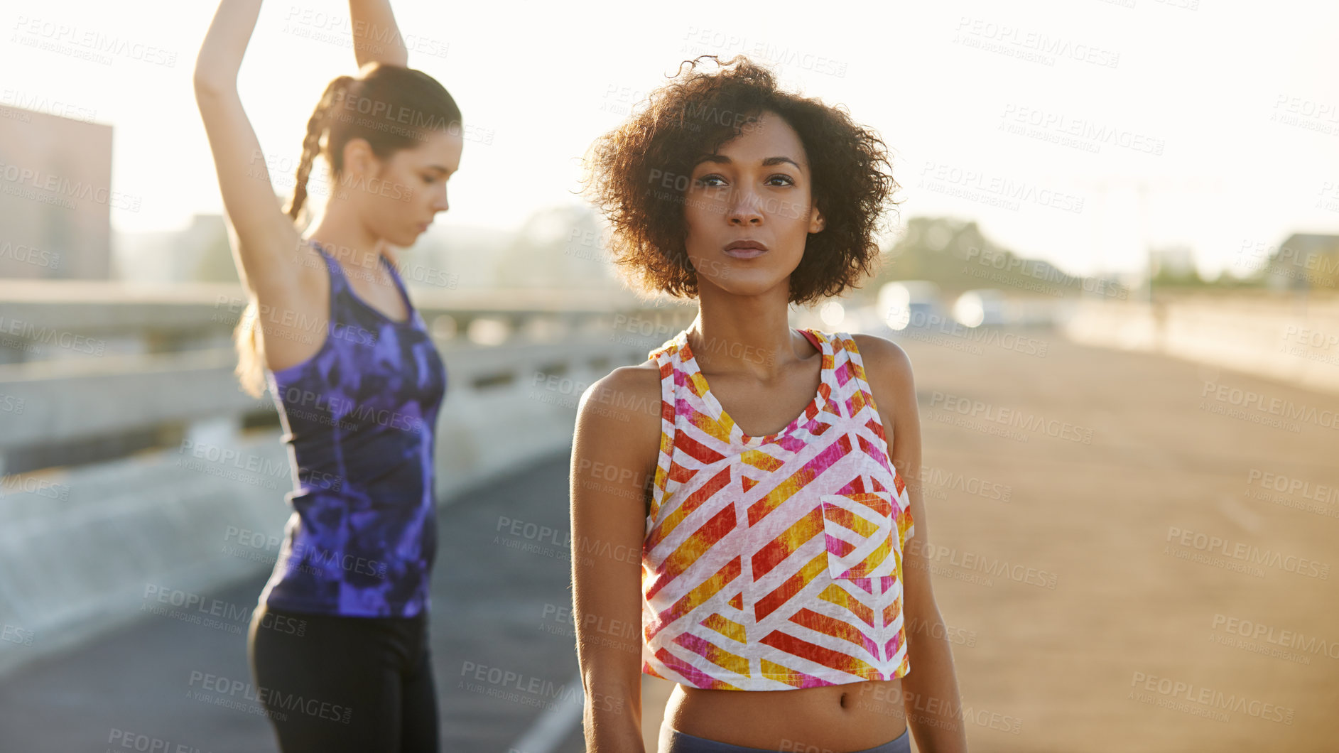 Buy stock photo Woman, street and friends with fitness for stretching, workout or outdoor exercise together in city. Young, active female person or runners in warm up, training or confidence for health and wellness