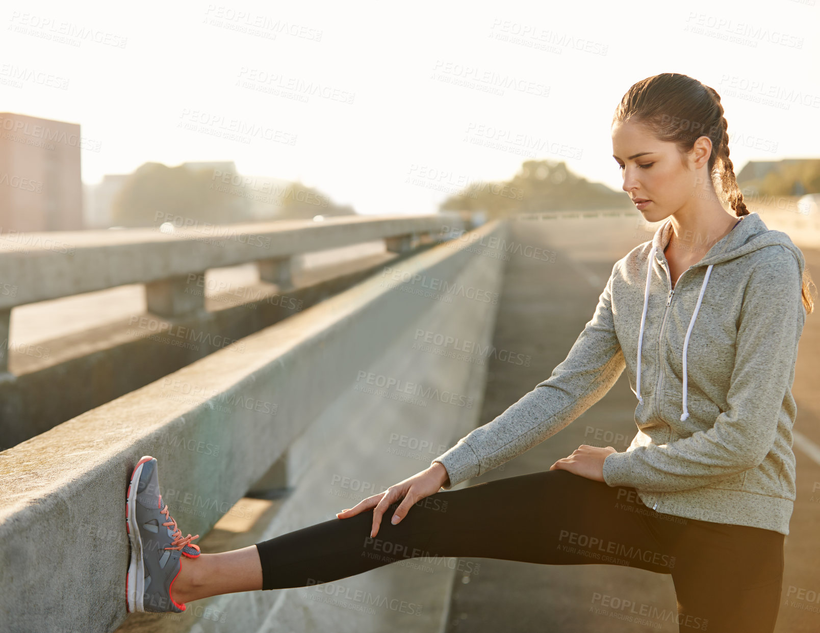 Buy stock photo Woman, fitness and stretching with leg on road for workout preparation, training or outdoor exercise. Young, female person or runner in warm up or getting ready for run or cardio in an urban town