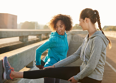 Buy stock photo Women, friends and stretching with leg in fitness on road for workout preparation, training or outdoor exercise. Young, female people or runners in warm up or getting ready for run or cardio in town