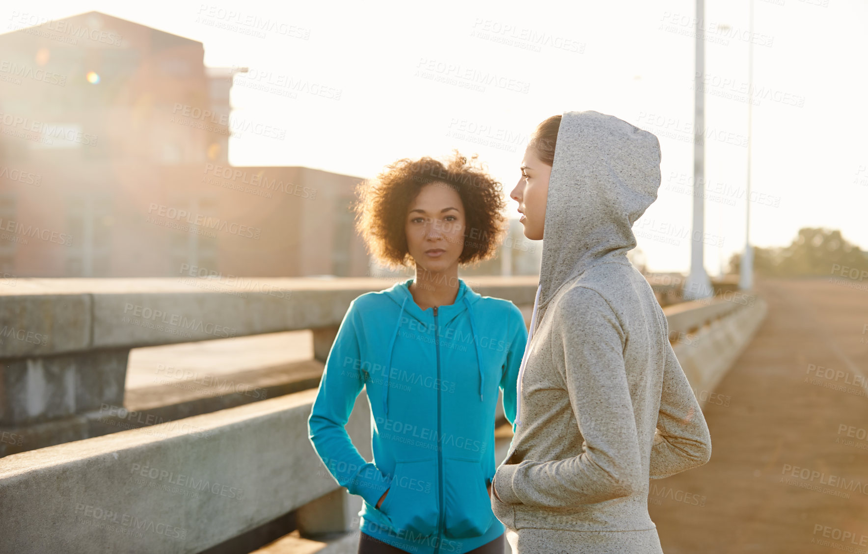 Buy stock photo Runner, women and friends in ready at sunrise, portrait and start for fitness, training and health on bridge. People, city and workout on metro road with exercise, teamwork and prepare for marathon