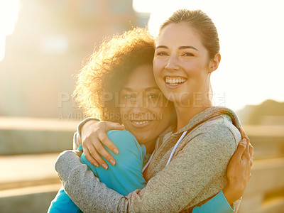 Buy stock photo Friends, portrait and hug in city for fitness, exercise and running session for marathon challenge outdoor. Sunshine, people and women with embrace for wellness goals, support and bonding together