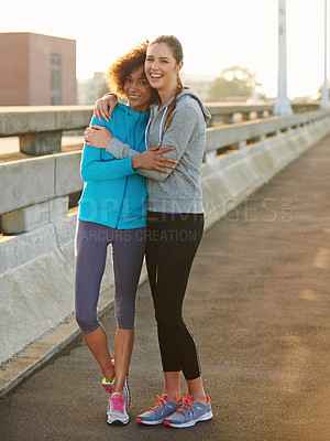 Buy stock photo Friends, portrait and embrace in city for fitness, exercise or running session for marathon challenge outdoor. Bridge, people or women with hug for wellness goals, support or bonding in road by space