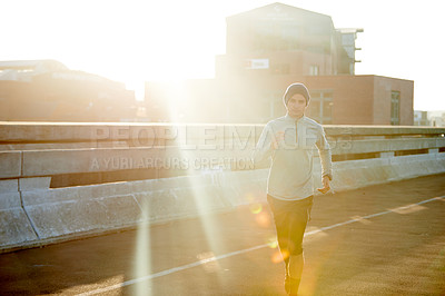 Buy stock photo Man, runner and sunrise in road, exercise and outdoor for fitness, training and health in morning. Person, bridge and direction on metro street at dawn for workout, progress and prepare for marathon