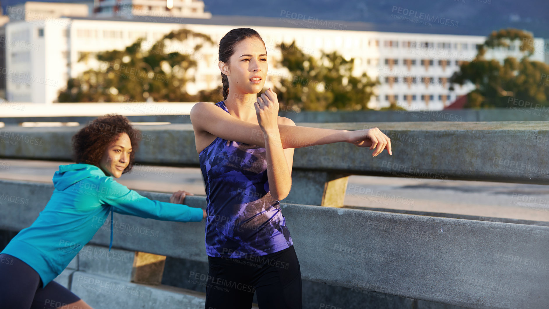 Buy stock photo Woman, friends and stretching with fitness in city for workout preparation, training or outdoor exercise. Active, young and female person getting ready in warm up for cardio or run in an urban town