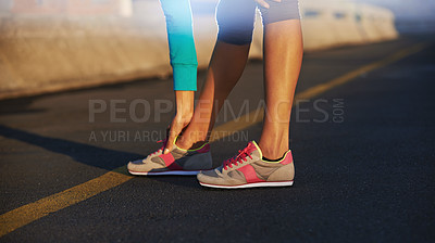 Buy stock photo Person, stretching and legs on road for fitness, sneakers and ready for exercise. Athlete, runner or hands on feet in street for wellness, training or running shoes for sport or outdoor activity