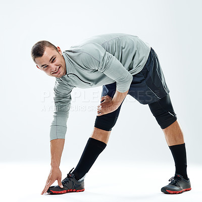 Buy stock photo Portrait, stretching and man with fitness, smile and athlete on white studio background. Face, person and model with exercise, workout and challenge with wellness, training and balance with health 