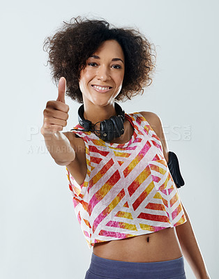 Buy stock photo Portrait of a young woman showing thumbs up
