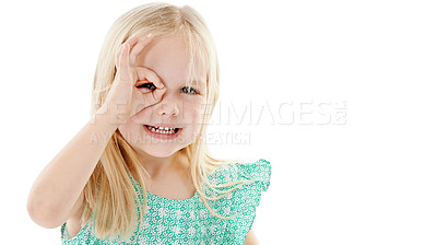 Buy stock photo Studio shot of a cute little girl covering her eye with her fingers against a white background
