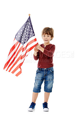 Buy stock photo America, flag and portrait of kid in studio for government, patriotism and pride in country. Little child, happy and relax with fabric by white background for national elections, voting and democracy