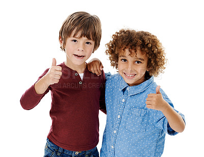 Buy stock photo Studio shot of two cute little boys giving you thumbs up against a white background