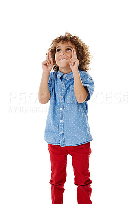 Buy stock photo Child, thinking and fingers crossed in studio for luck, hope and excited for competition draw. Boy kid, hand gesture and wish on white background for miracle, faith and optimism for good news or win