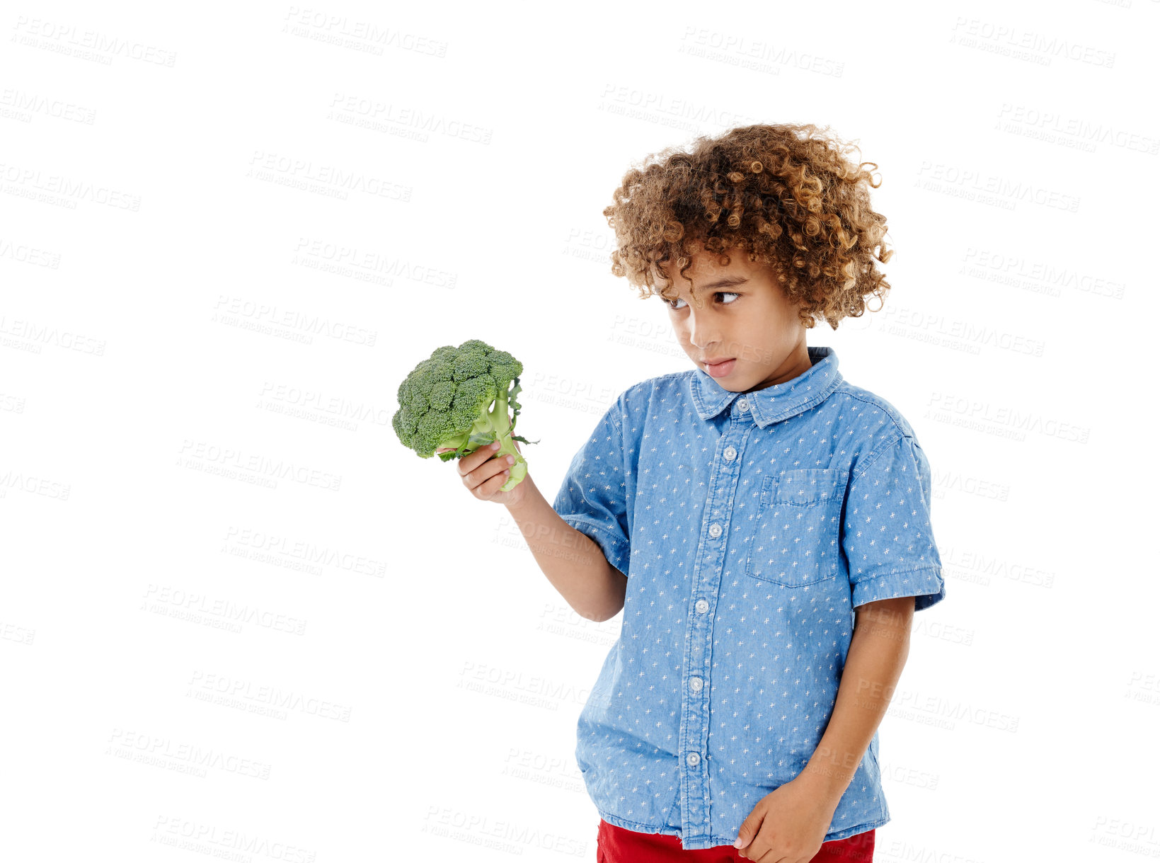 Buy stock photo Boy, child and broccoli in studio with choice, disgust and confused with food by white background. Kid, vegetable and thinking for decision with vegan meal, nutrition and annoyed with mock up space