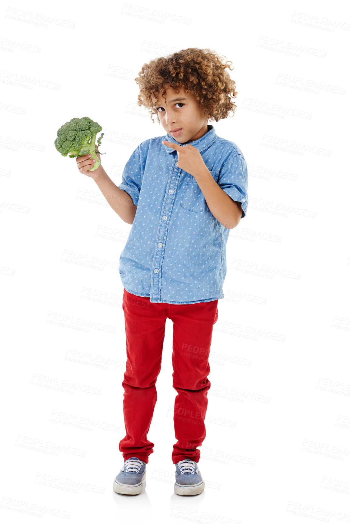 Buy stock photo Young boy, portrait and pointing with broccoli for vegetable nutrition, healthy snack or vitamins on a white studio background. Child, kid or vegetarian with natural or green organic food for fiber