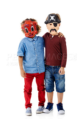 Buy stock photo Children, hug and face mask in studio for halloween party with pirate, animal and costume by white background. Friends, embrace and kids with fantasy for character, fashion and playful at event