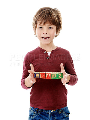 Buy stock photo Happy, studio and portrait of kid with building blocks for learning, education or child development. Creative, childhood and isolated young boy with school toys for spelling games on white background