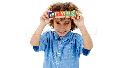 Buy stock photo Playing, studio and portrait of child with building blocks for learning, education and development. Creative, childhood and isolated young boy with school toys for spelling games on white background